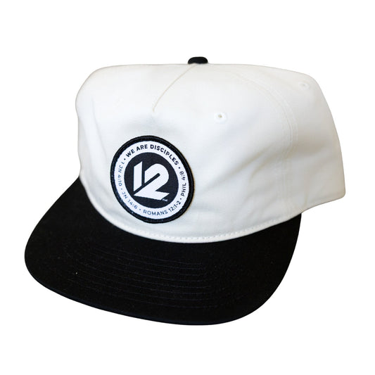 White and black cap with a logo on a white background