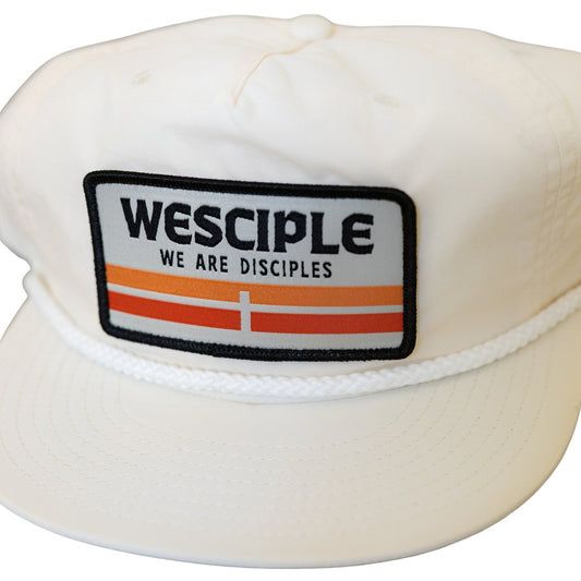 White cap with Wesciple logo on a white background